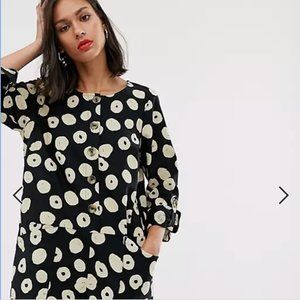 Long sleeved button front romper